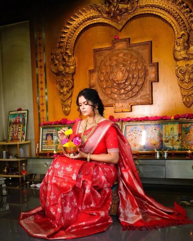 red Saree with a long back pallu