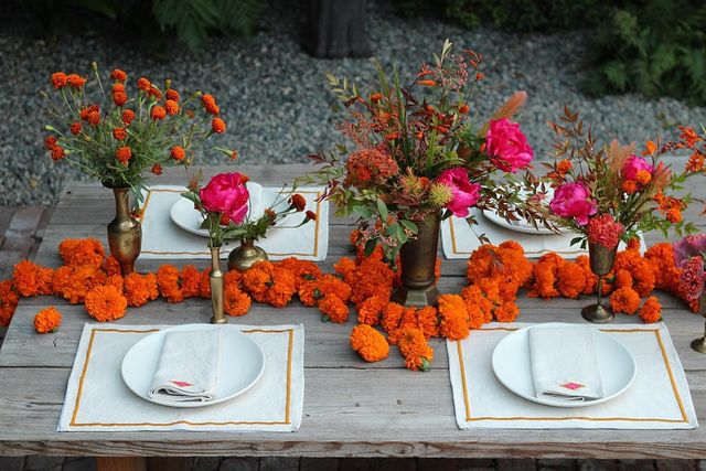 A dinner table décor with marigold