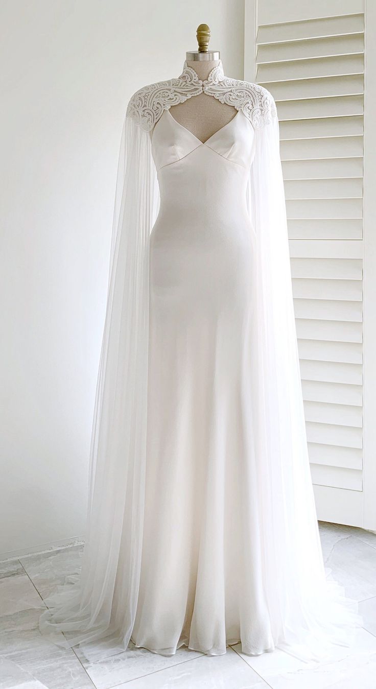 White Tulle Gown With an Embroidered Cape